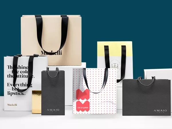 What paper is commonly used for handbag packaging?